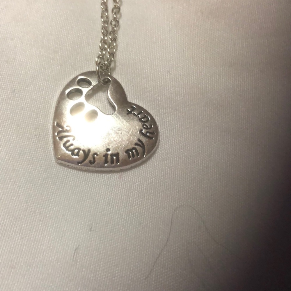Necklace with paw print.